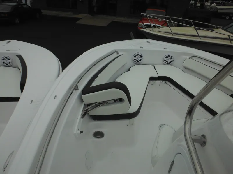 Slide: The Image of 2025 Tidewater 198 CC Adventure boat interior with cushioned seating and speakers. - 6