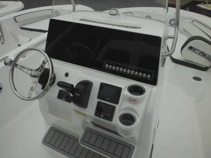Slide: The Image of 2025 Tidewater 198 CC Adventure boat console with steering wheel and controls. - 8