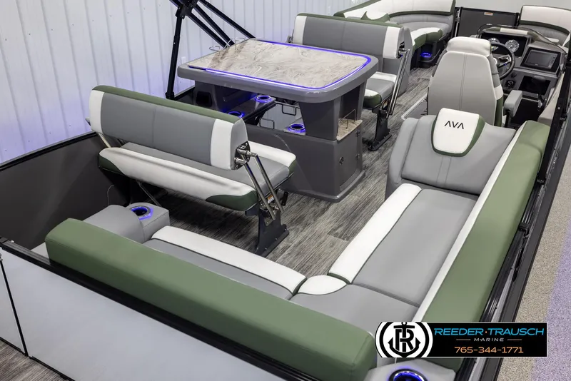 Slide: The Image of 2025 Avalon Catalina Entertainer boat interior with modern seating and table setup. - 12