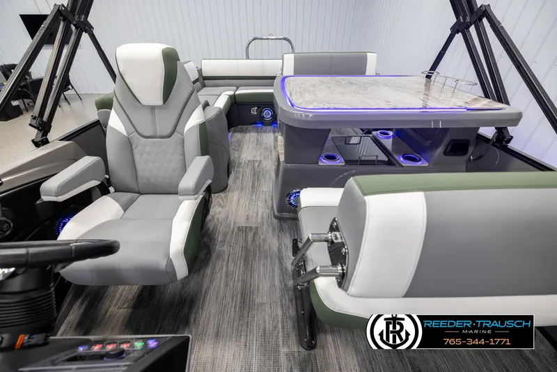 Slide: The Image of 2025 Avalon Catalina Entertainer interior with modern seating and illuminated table. - 14