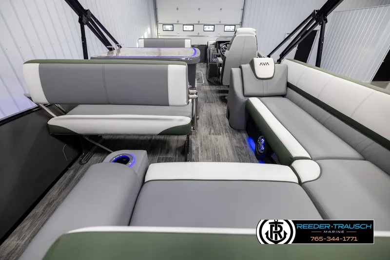 Slide: The Image of 2025 Avalon Catalina Entertainer boat interior with modern seating and ambient lighting. - 16