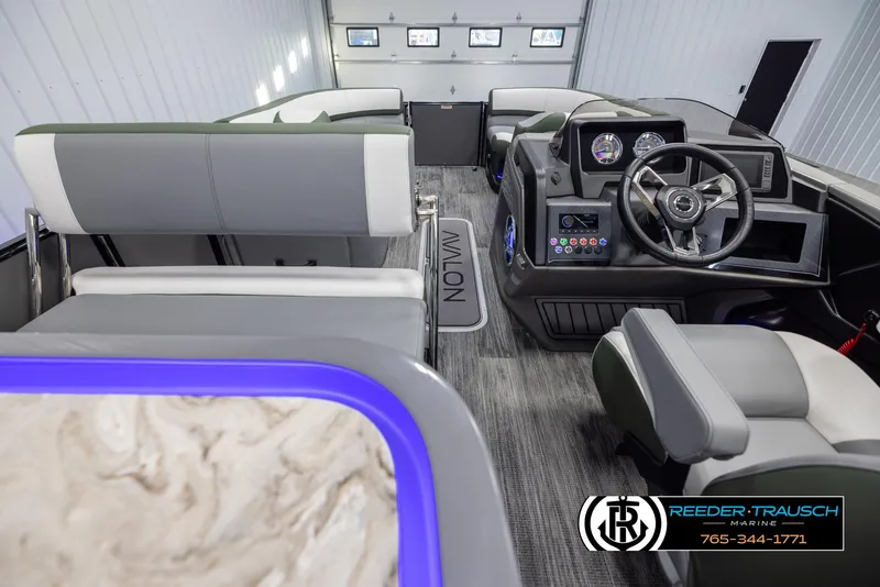 Slide: The Image of Interior of 2025 Avalon Catalina Entertainer boat with modern seating and control panel. - 17