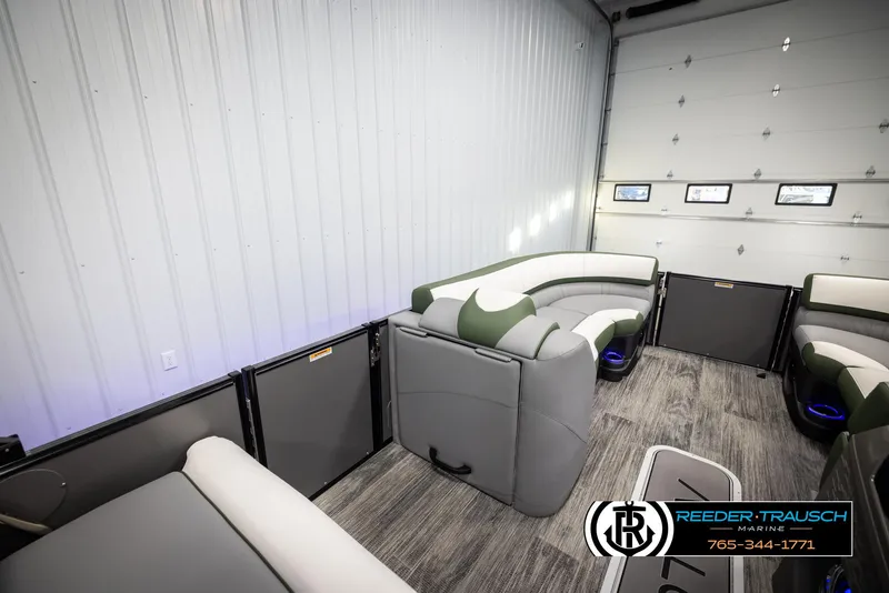 Slide: The Image of 2025 Avalon Catalina Entertainer interior with modern seating in a showroom. - 20