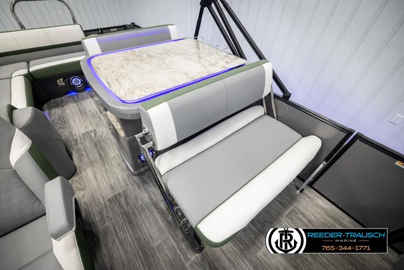 Slide: The Image of 2025 Avalon Catalina Entertainer interior with modern seating and illuminated table. - 23