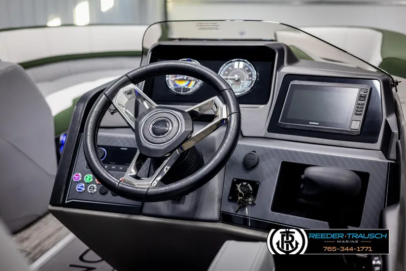 Slide: The Image of 2025 Avalon Catalina Entertainer dashboard with steering wheel and digital display. - 24
