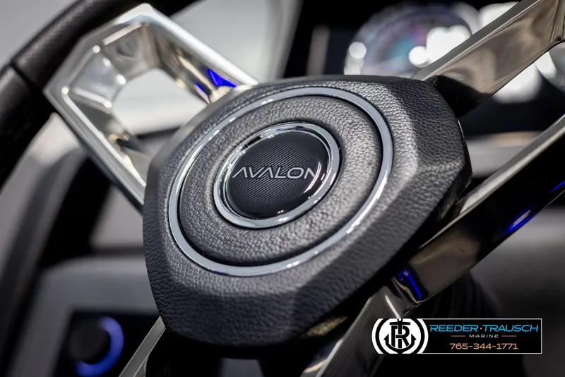 Slide: The Image of Close-up of 2025 Avalon Catalina Entertainer steering wheel with logo. - 26