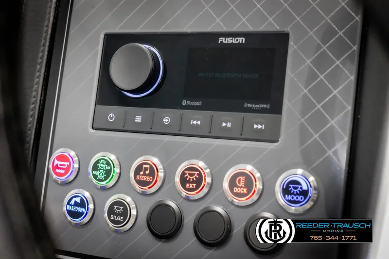 Slide: The Image of Control panel of 2025 Avalon Catalina Entertainer with illuminated buttons and audio system. - 27