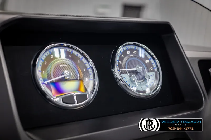 Slide: The Image of 2025 Avalon Catalina Entertainer dashboard with dual gauges, Reeder-Trausch branding. - 28