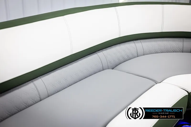 Slide: The Image of 2025 Avalon Catalina Entertainer boat seating with green and gray upholstery. - 31