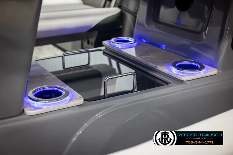 Slide: The Image of 2025 Avalon Catalina Entertainer boat interior with illuminated cup holders and sleek design. - 37
