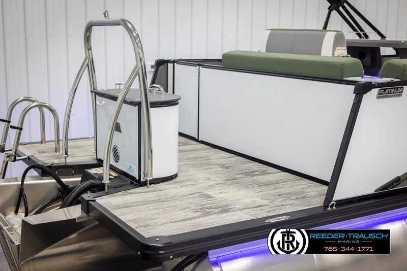 Slide: The Image of 2025 Avalon Catalina Entertainer boat with swim ladder and deck, showcased indoors. - 42