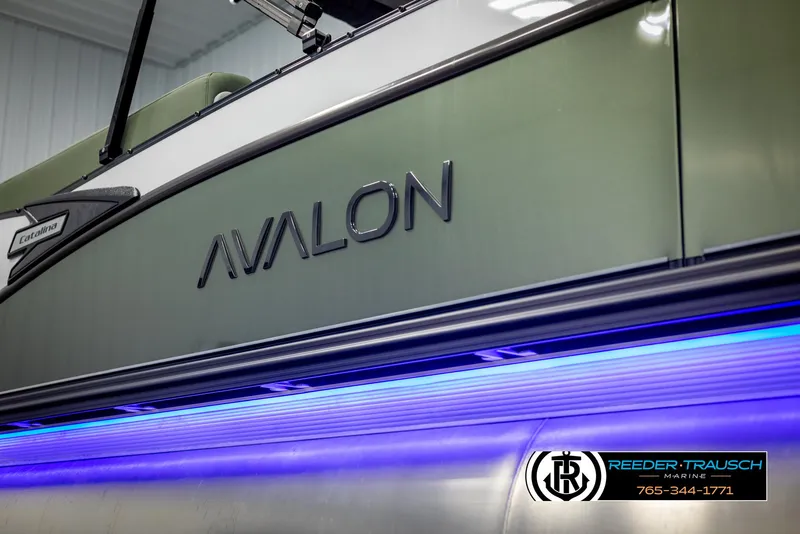 Slide: The Image of 2025 Avalon Catalina Entertainer boat with blue LED lighting, Reeder-Trausch Marine logo. - 45