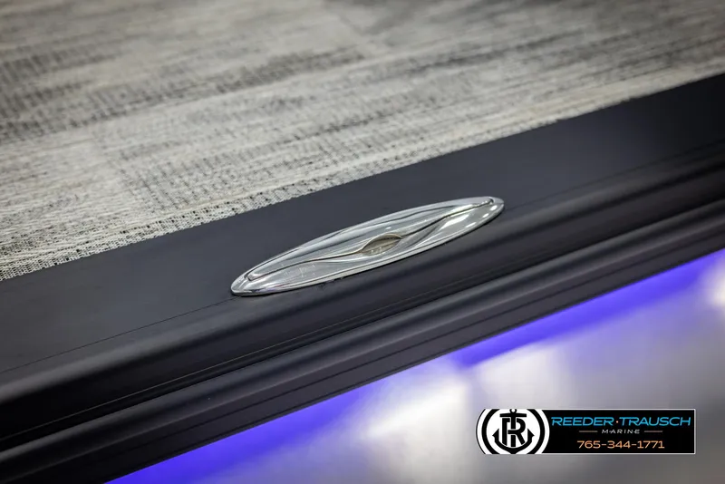 Slide: The Image of 2025 Avalon Catalina Entertainer boat detail with blue LED lighting and Reeder-Trausch Marine logo. - 48