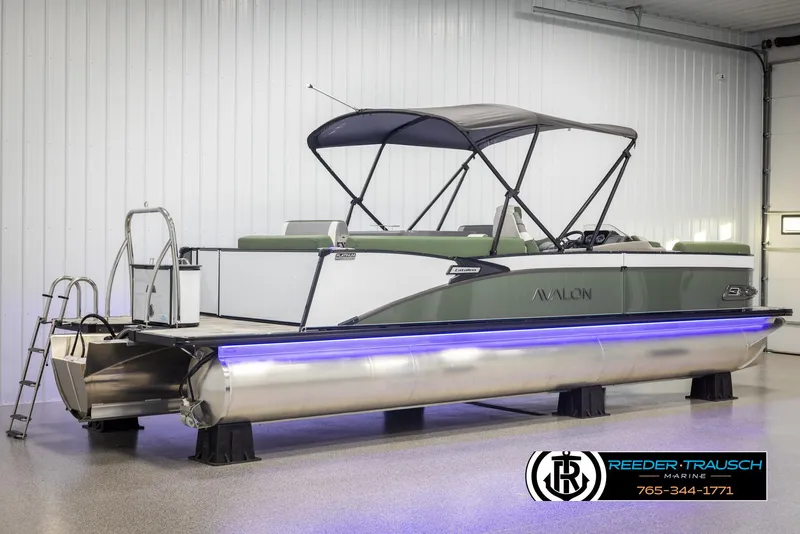Slide: The Image of 2025 Avalon Catalina Entertainer pontoon boat with canopy and LED lights in showroom. - 6