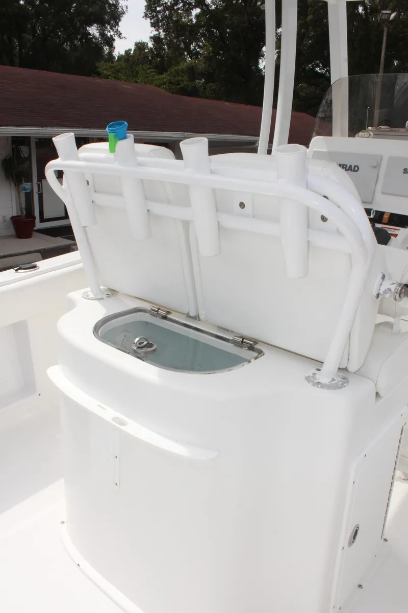 Slide: The Image of 2015 Sea Hunt Ultra 235 SE boat with rod holders and livewell. - 13