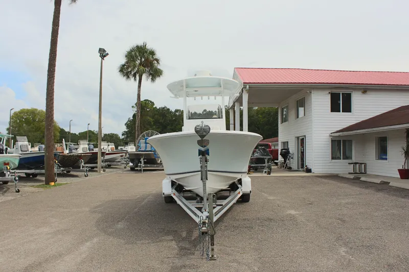 Slide: The Image of 2015 Sea Hunt Ultra 235 SE boat on trailer at dealership. - 2
