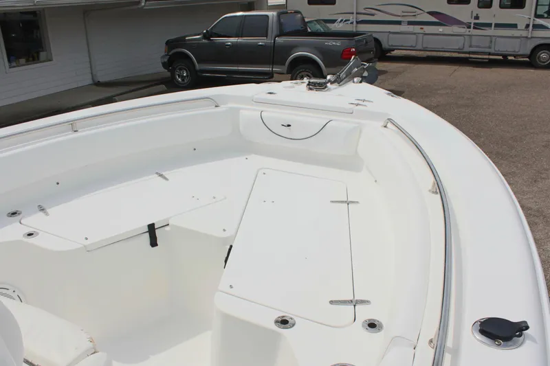 Slide: The Image of 2015 Sea Hunt Ultra 235 SE boat interior with seating and storage compartments. - 28