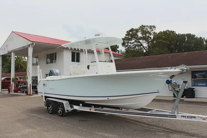 Slide: The Image of 2015 Sea Hunt Ultra 235 SE boat on trailer at dealership. - 3