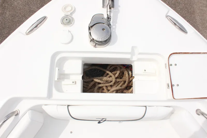 Slide: The Image of 2015 Sea Hunt Ultra 235 SE boat deck with rope storage compartment. - 31