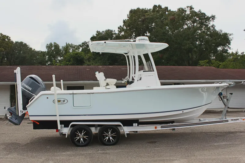Slide: The Image of 2015 Sea Hunt Ultra 235 SE boat on trailer, side view, outdoors. - 4