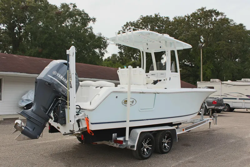 Slide: The Image of 2015 Sea Hunt Ultra 235 SE boat on trailer with Yamaha outboard motor. - 5