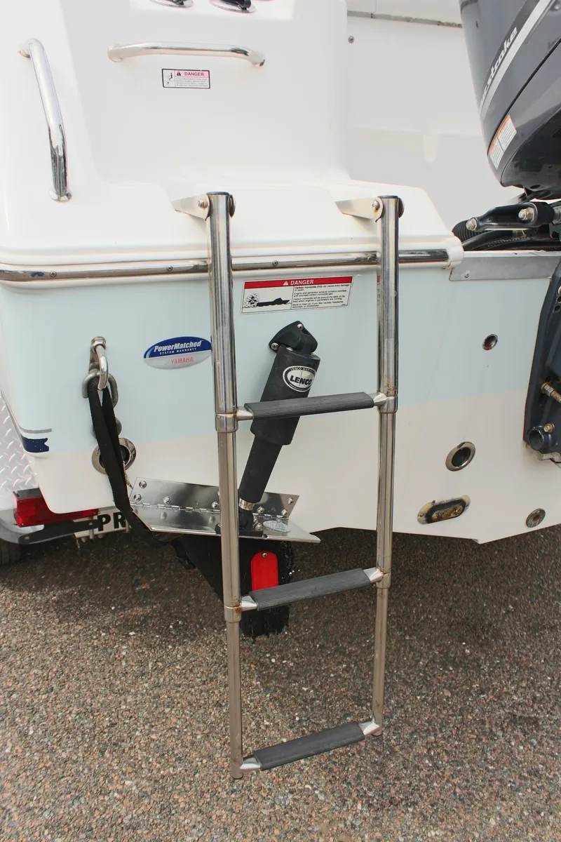 Slide: The Image of 2015 Sea Hunt Ultra 235 SE boat with stainless steel swim ladder. - 8