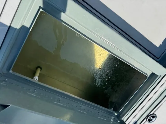 Slide: The Image of Open compartment of 2025 Custom Ultimate Panfish XL boat, showing interior details. - 19