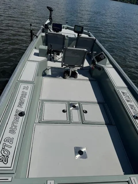 Slide: The Image of Custom Ultimate Panfish XL 2025 fishing boat on calm water. - 20