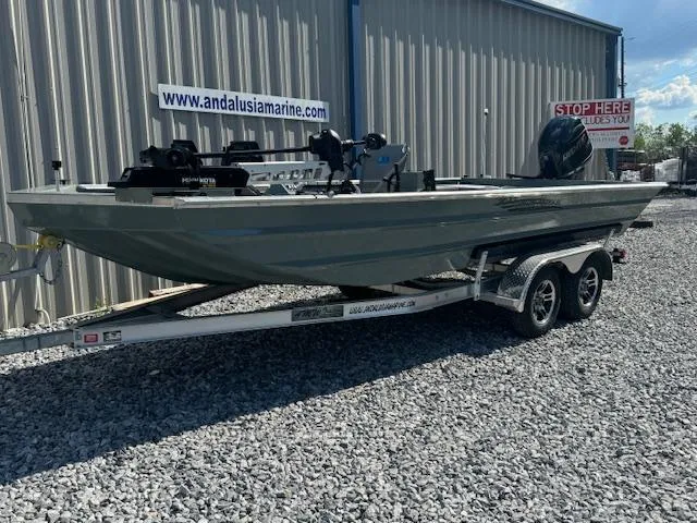 Slide: The Image of Custom Ultimate Panfish XL 2025 boat on trailer outside Andalusia Marine. - 25