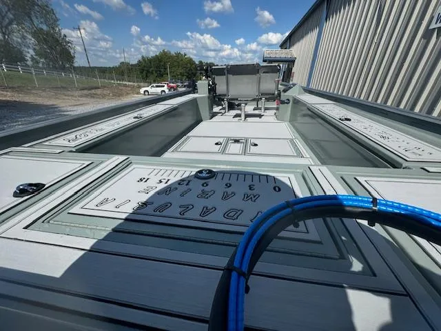 Slide: The Image of Custom Ultimate Panfish XL 2025 boat with spacious deck and storage compartments. - 29