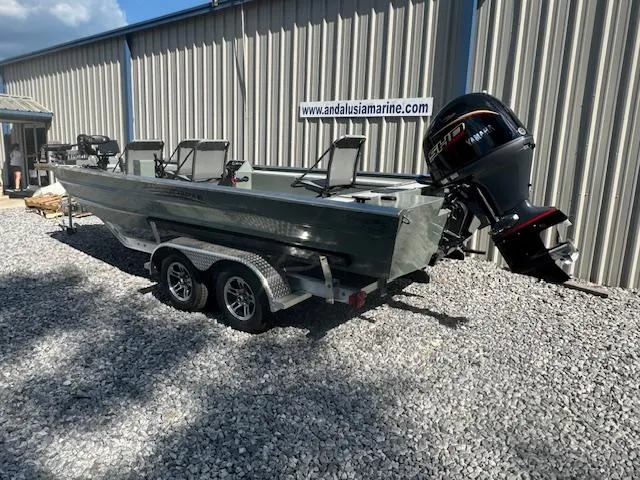 Slide: The Image of Custom Ultimate Panfish XL 2025 boat on trailer outside Andalusia Marine. - 30