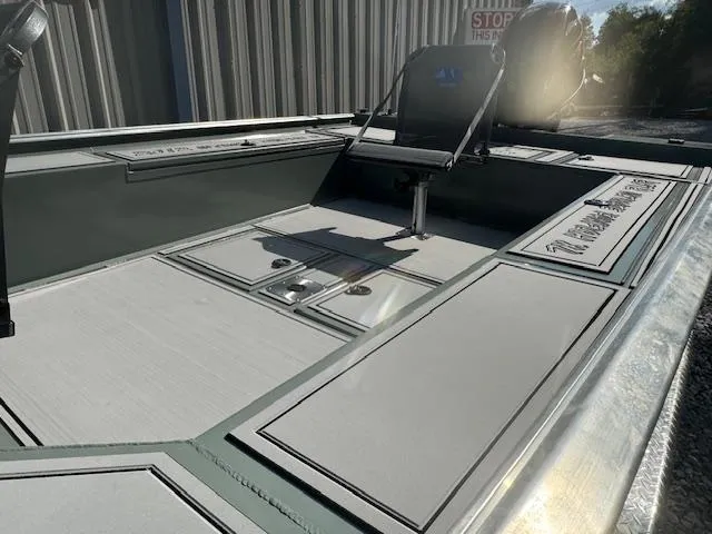 Slide: The Image of Custom Ultimate Panfish XL 2025 boat interior with seating and storage compartments. - 31
