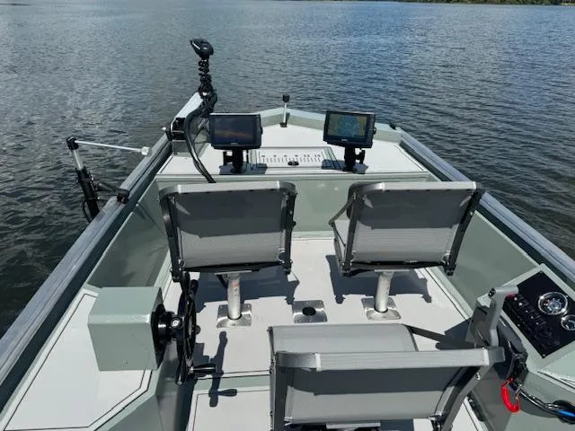 Slide: The Image of Custom Ultimate Panfish XL 2025 boat with dual seats and advanced navigation systems on a lake. - 4