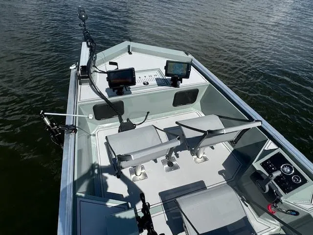 Slide: The Image of Custom Ultimate Panfish XL 2025 fishing boat with dual seats and advanced navigation systems. - 7