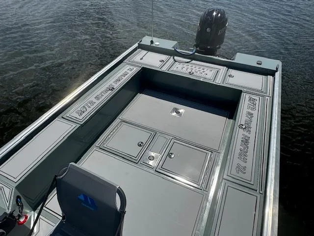Slide: The Image of 2025 Custom Ultimate Panfish XL boat with spacious deck and storage compartments. - 8