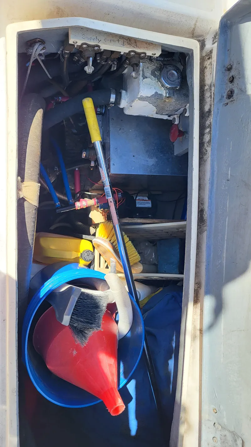 Slide: The Image of Storage compartment of 1979 Pearson 365 Sloop with tools and equipment. - 13