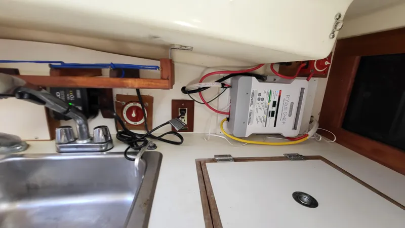 Slide: The Image of 1979 Pearson 365 Sloop interior with sink and electrical panel. - 22