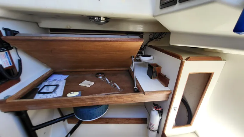 Slide: The Image of 1979 Pearson 365 Sloop interior with navigation desk and storage. - 26