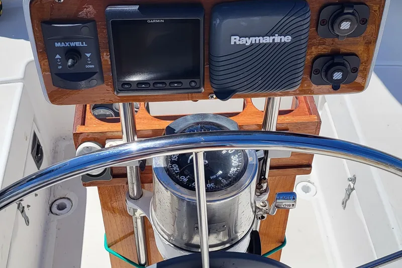 Slide: The Image of 1979 Pearson 365 Sloop cockpit with navigation instruments and steering wheel. - 29