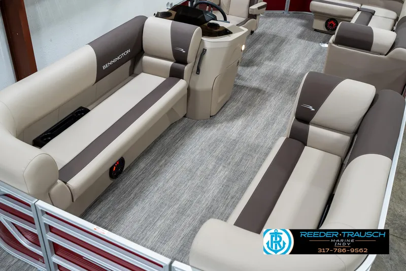 Slide: The Image of 2025 Bennington 21 SLS pontoon boat interior with beige and brown seating. - 11