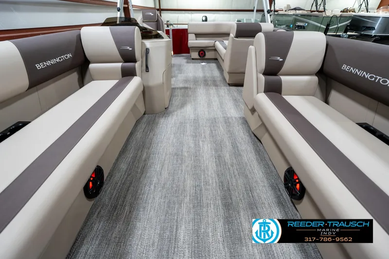 Slide: The Image of 2025 Bennington 21 SLS pontoon boat interior with plush seating and modern design. - 12