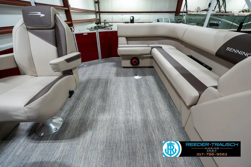 Slide: The Image of 2025 Bennington 21 SLS boat interior with plush seating and modern design. - 13