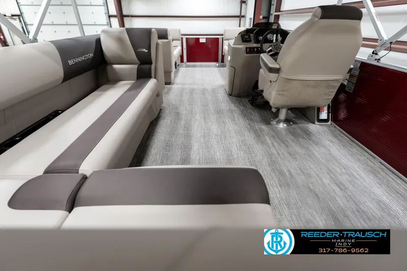 Slide: The Image of 2025 Bennington 21 SLS pontoon boat interior with plush seating and modern design. - 15