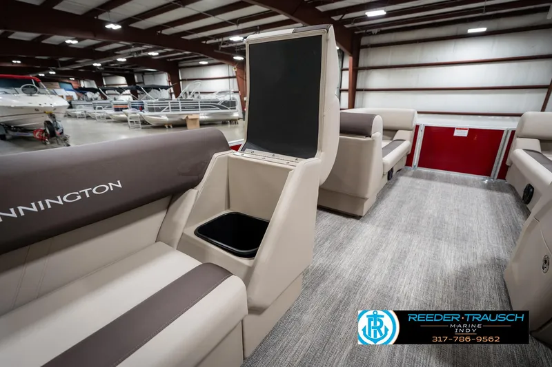 Slide: The Image of 2025 Bennington 21 SLS pontoon boat interior with storage compartment in showroom. - 26