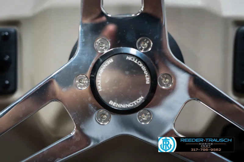 Slide: The Image of Close-up of 2025 Bennington 21 SLS steering wheel with logo. - 29