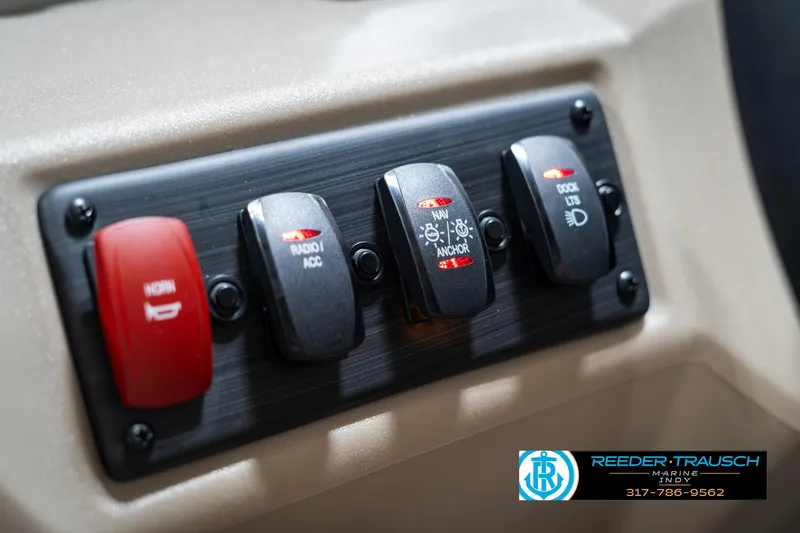 Slide: The Image of Control panel of 2025 Bennington 21 SLS boat with labeled switches. - 31