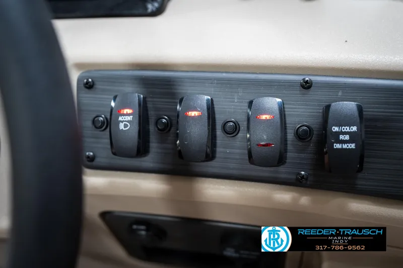 Slide: The Image of Control panel of 2025 Bennington 21 SLS boat with accent lighting switches. - 34