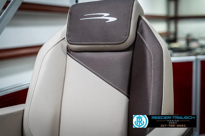 Slide: The Image of 2025 Bennington 21 SLS boat seat with logo, featuring beige and brown upholstery. - 37