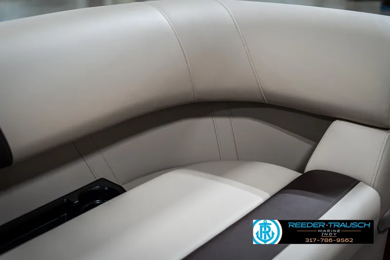 Slide: The Image of 2025 Bennington 21 SLS boat interior with beige and brown seating. - 38