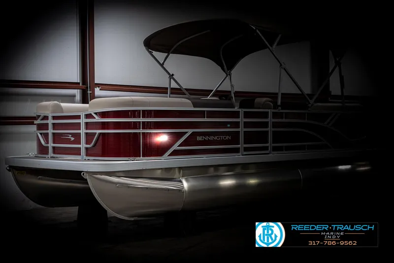 Slide: The Image of 2025 Bennington 21 SLS pontoon boat in showroom, side view. - 4